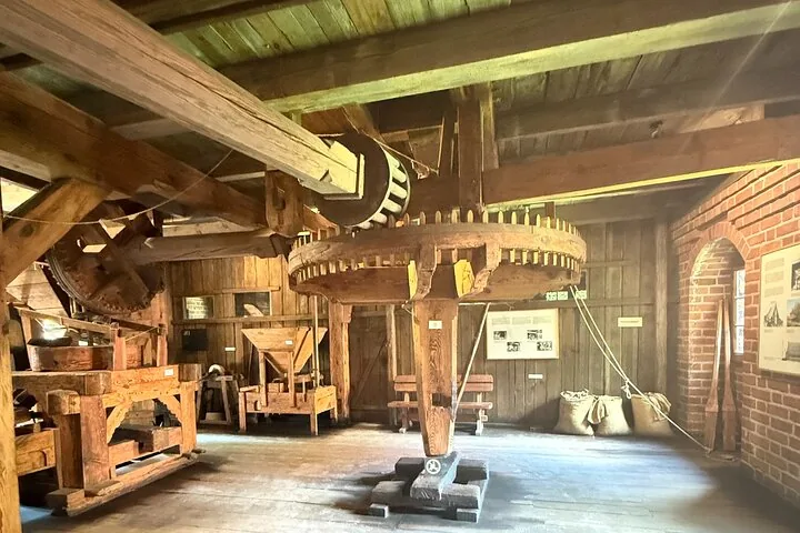 Historical wooden machinery inside a mill room at Malbork Castle.